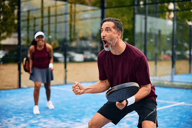 Padel players celebrating together